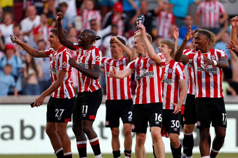 Brentford’s players celebrate on the pitch after the English Premier League football match