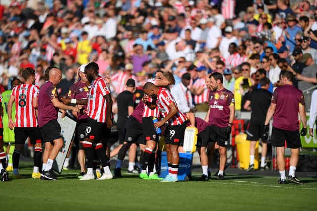Players of Brentford FC take part in a water break during the Premier League match between Brentford FC and Manchester United 