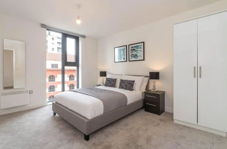 Stylish bedroom at the flat at The Bank on Sheepcote Street. It costs less than the average price of £288k.
Credit: Zoopla 