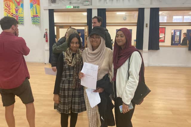 Portsmouth Academy pupil Samirah Samad, 16, in the middle, celebrating her results. Picture: Steve Deeks.