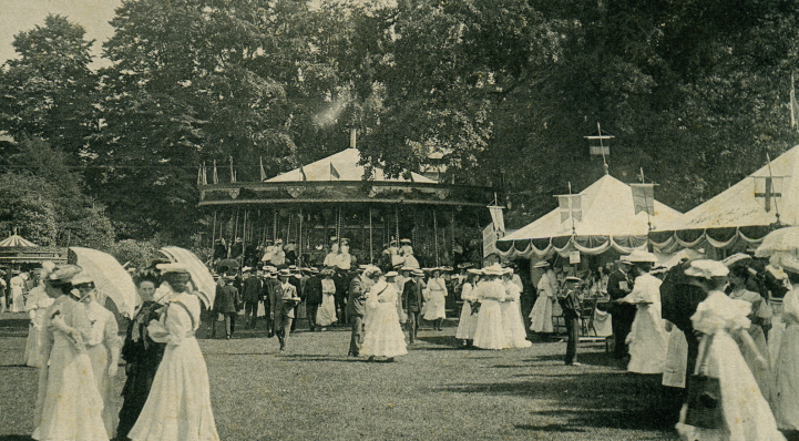 Edwardians enjoy a fete at the zoo, complete with stalls and carousel.