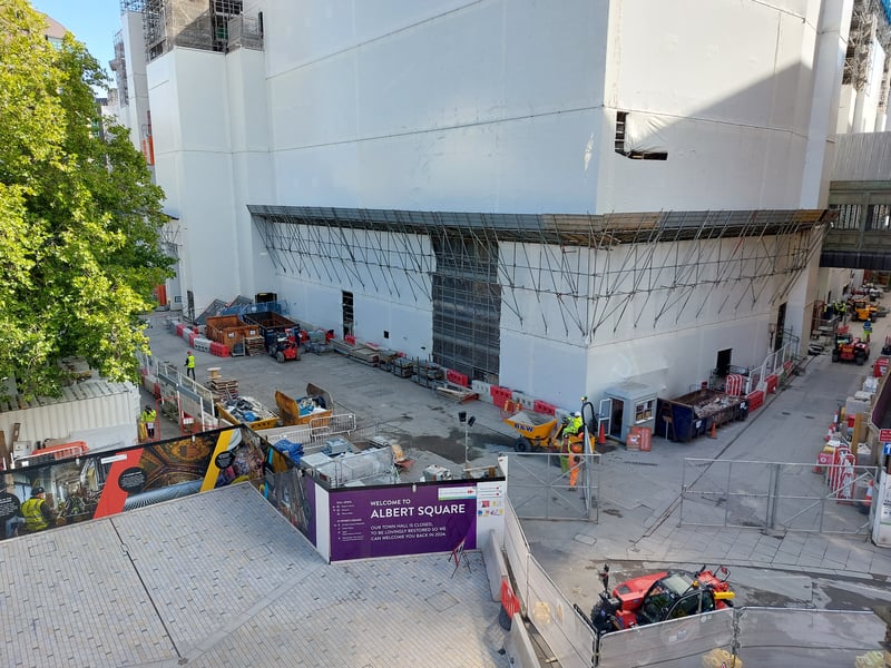 Construction equipment surrounds the Town Hall, which is entirely covered in scaffolding. Credit: Sofia Fedeczko/Manchester World