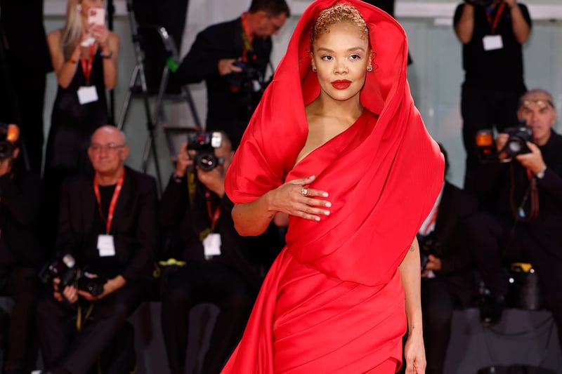 Tessa Thompson looked chic in a sultry red look (Photo by John Phillips/Getty Images for Netflix)