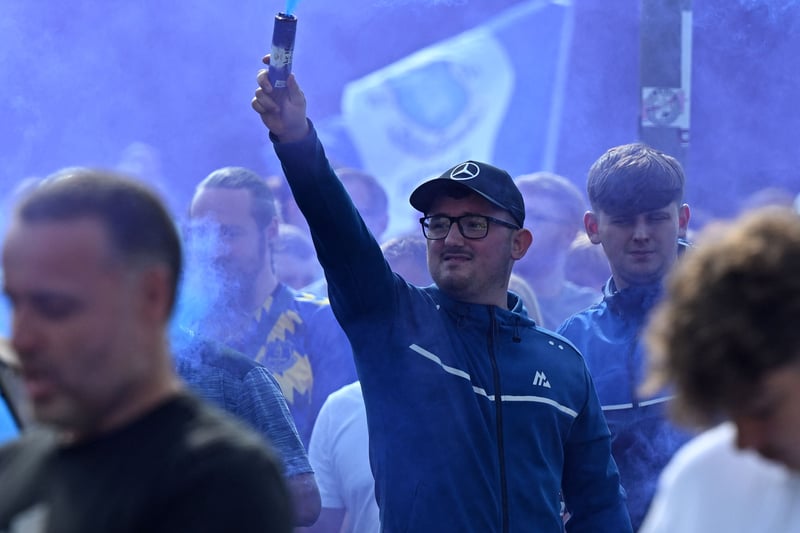 Everton fans welcome in the team coach ahead of the Merseyside derby.