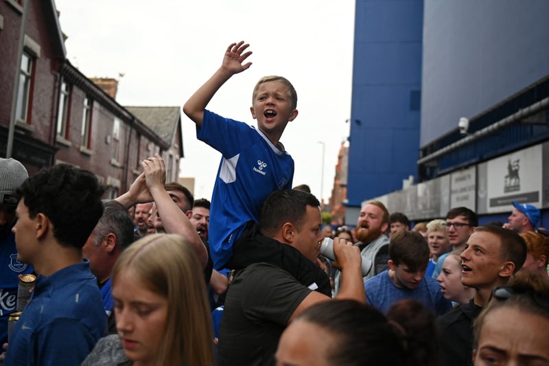 Everton fans welcome in the team coach ahead of the Merseyside derby.
