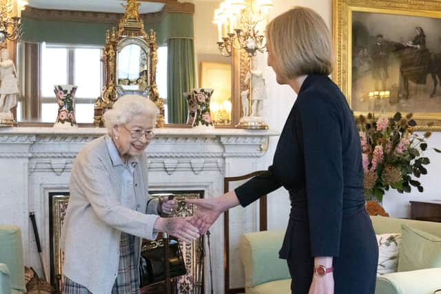 Queen Elizabeth II welcomes Liz Truss during an audience at Balmoral, Scotland, where she invited the newly elected leader of the Conservative party to become Prime Minister and form a new government. Credit: PA