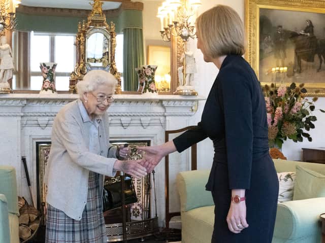 Queen Elizabeth II welcomes Liz Truss during an audience at Balmoral, Scotland, where she invited the newly elected leader of the Conservative party to become Prime Minister and form a new government. Credit: PA