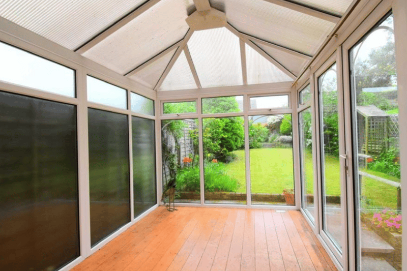 A conservatory looks out on to the garden, with plenty of space for entertaining.