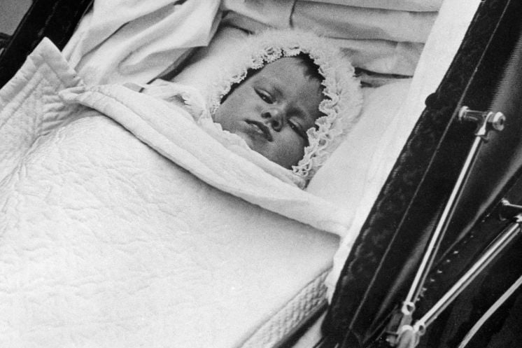 Queen Elizabeth II is pictured in her baby carriage for her first outing on October 9, 1926.