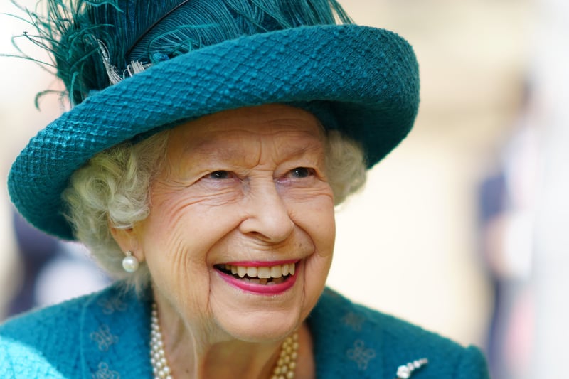 A memorable image of the smiling Queen as she arrives in Manchester