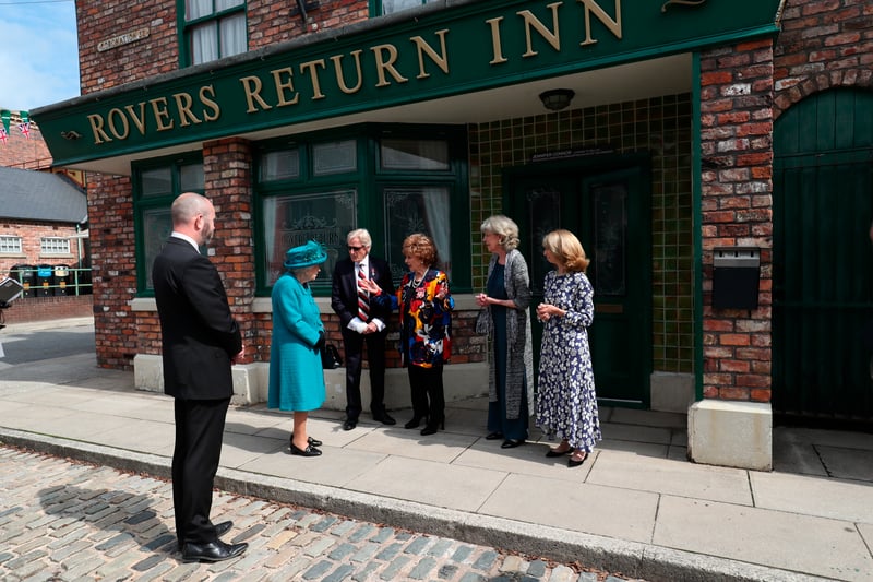 Queen Elizabeth II meets Coronation Street actors William Roache, fourth right, Barbara Knox, third right, Sue Nicholls and Helen Worth, right.