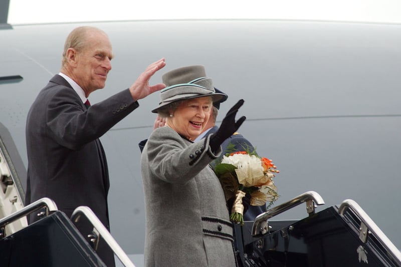  Her Majesty Queen Elizabeth and her husband Prince Philip, Duke of Edinburgh, wave good-bye at the Vancouver airport on October 8, 2002 in Vancouver, British Columbia. 