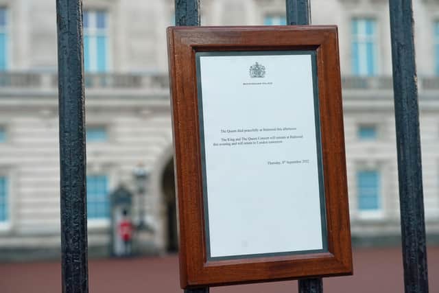 A notice on the gates of the Buckingham Palace in London announcing the death of Queen Elizabeth II. Picture: PA.