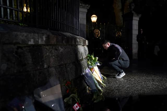 Mourners gather laying flowers outside Balmoral following the announcement of the death of Queen Elizabeth II. Picture: PA.