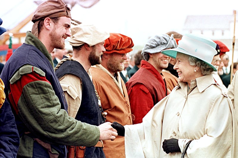 Queen Elizabeth II shakes hands with a crew member of the Matthew, in Bonavista, Canada, after it travelled from Bristol. The Matthew is a replica of the ship that John Cabot sailed 500 years ago when he discovered Canada. The Matthew left Bristol, England, 02 May and arrived 24 June to re-enact the landing.