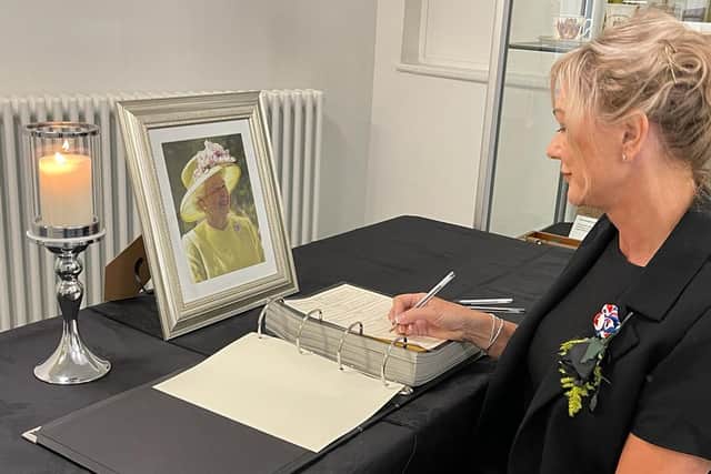 Cathryn Riley signing the book of condolence at Dewsbury Town Hall