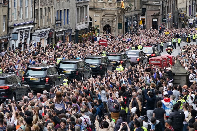 The cortege carrying the coffin of Queen Elizabeth II passes through the streets of Edinburgh, past large crowds