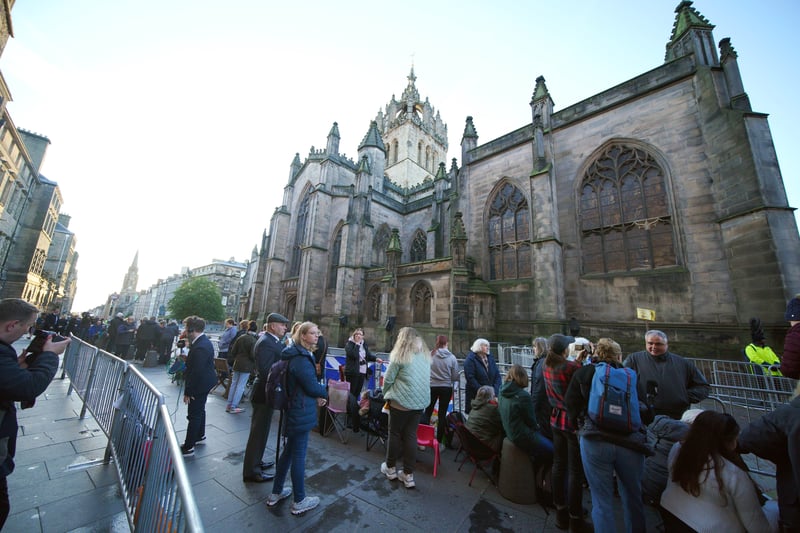 People gather outside St Giles’ Cathedral, in Edinburgh, ahead of the Procession of Queen Elizabeth’s coffin.