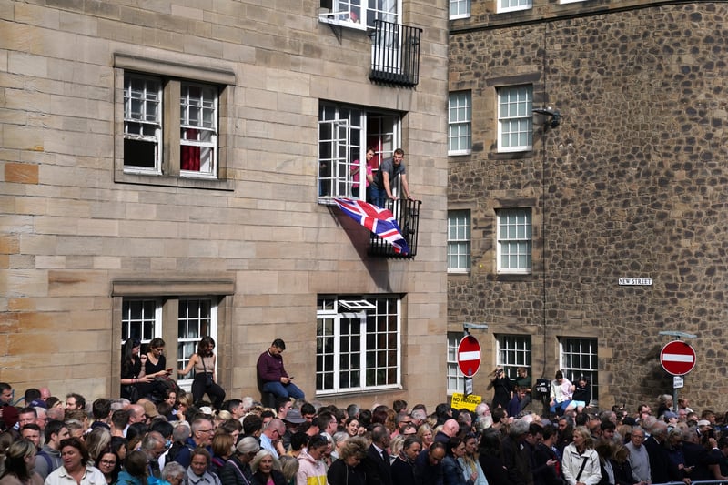 Members of the public gather in the Royal Mile in Edinburgh, ahead of the procession of Queen Elizabeth II coffin from the Palace of Holyroodhouse to St Giles’ Cathedral, Edinburgh.