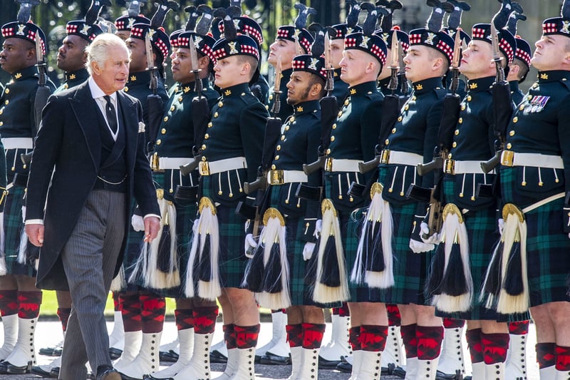 King Charles III inspects the guard of honour at the Ceremony of the Keys at the Palace of Holyroodhouse.