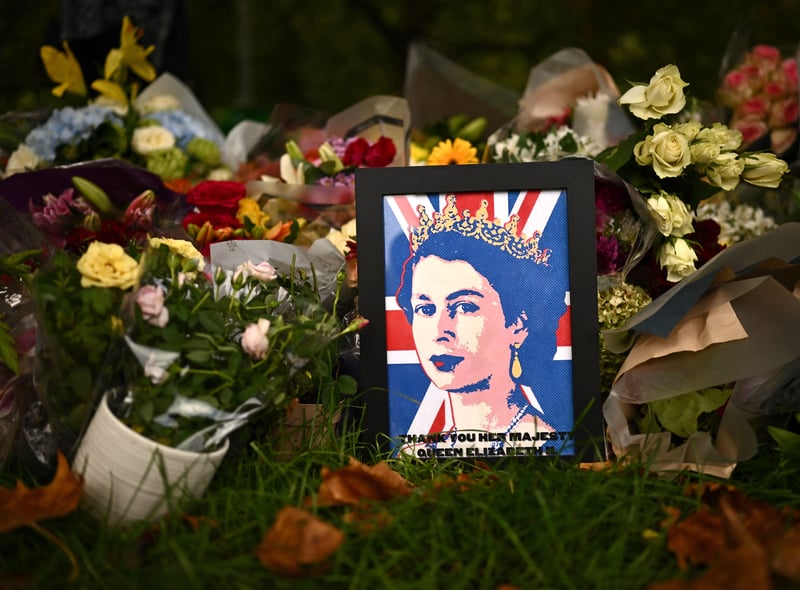 The iconic image of the Queen is emblazoned across a Union Jack backdrop and framed.