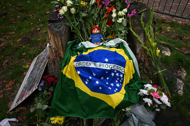 A tribute from Brazil featuring a small Paddington Bear and an array of flowers.