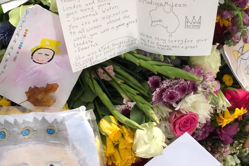 The Queen dressed in pink - drawn by a child - alongside a handwritten card thanking her for her service to London, Australia, Perth and for being “an inspiration to all women around the world”.