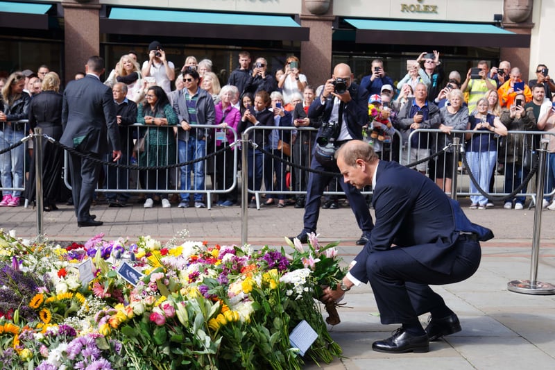 The Earl of Wessex lays a floral tribute in St Ann’s Square Credit: PA