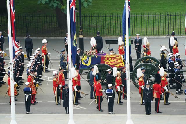 The State Gun Carriage carries the coffin of Queen Elizabeth II, draped in the Royal Standard with the Imperial State Crown and the Sovereign’s orb and sceptre. Picture: PA.