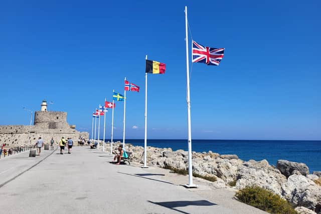 Union flag at half-past in Rhodes Harbour.