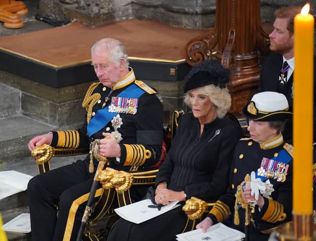 King Charles III, the Queen Consort and the Princess Royal in front of the coffin of Queen Elizabeth II during her State Funeral at the Abbey in London. Picture date: Monday September 19, 2022.