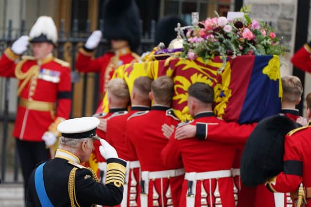 King Charles III salutes the coffin of Queen Elizabeth II. Picture: PA.