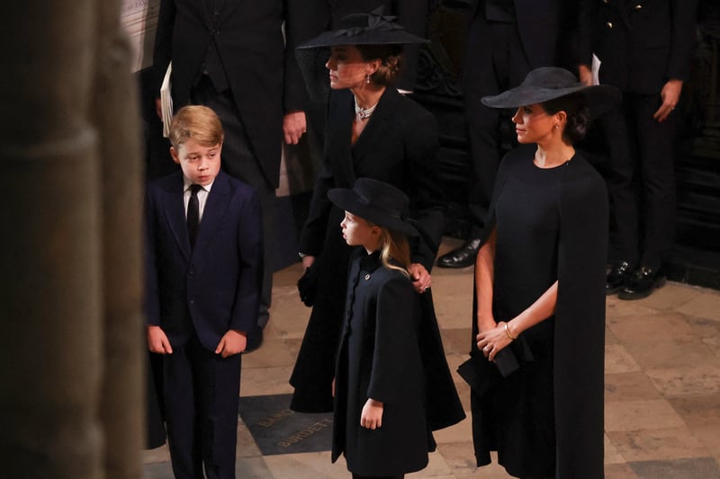 Prince George, Princess of Wales, Princess Charlotte of Wales and Meghan, Duchess of Sussex attend the state funeral.