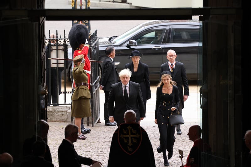 Former British Prime Ministers Theresa May and husband Philip May and Boris Johnson and wife Carrie Johnson attend the state funeral.
