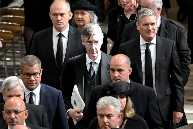 Secretary of State for Defence, Ben Wallace, Home Secretary, Suella Braverman, Chancellor Nadhim Zahawi, Lord High Chancellor Brandon Lewis, COP President Alok Sharma, Energy Minister Jacob Rees-Mogg, MP Ed Davey and Labour Party Leader Kier Starmer depart Westminster Abbey.