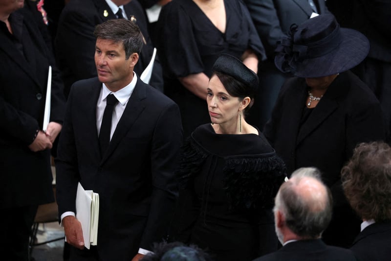 New Zealand’s Prime Minister Jacinda Ardern and husband Clarke Gayford attend the State Funeral.