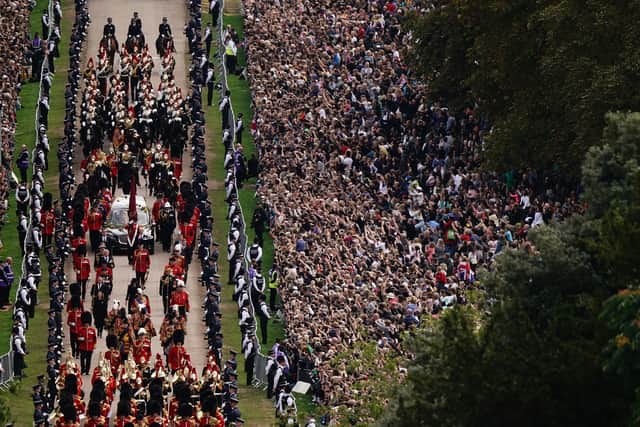 The Ceremonial Procession of the coffin of Queen Elizabeth II travels down the Long Walk as it arrives at Windsor Castle. Picture: PA.