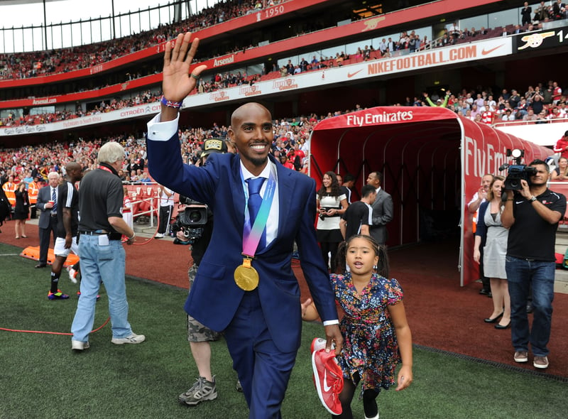 The former Team GB star showing off his gold medal at the Emirates Stadium. 