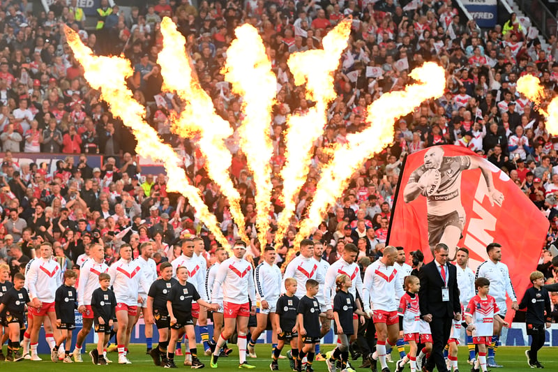 The players of St Helens and Leeds Rhinos walk out of the tunnel at Old Trafford. (Photo by Gareth Copley/Getty Images)