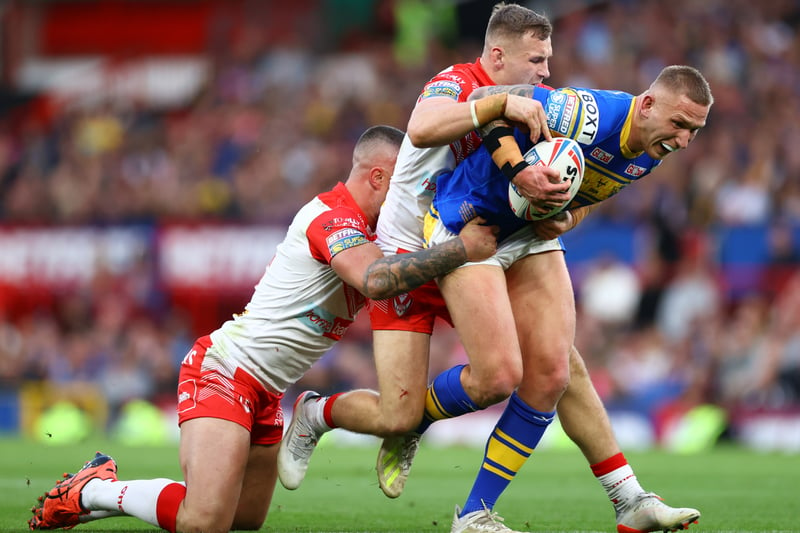 Mikolaj Oledzki of Leeds Rhinos is tackled by Curtis Sironen and Matty Lees of St Helens.  (Photo by Michael Steele/Getty Images)