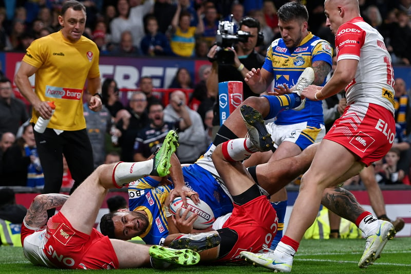 Rhyse Martin of Leeds Rhinos is held up over the try line. (Photo by Gareth Copley/Getty Images)