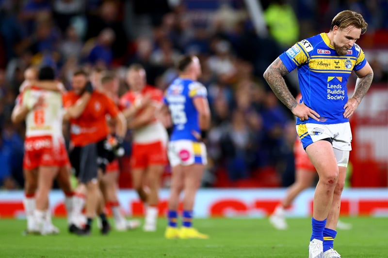 Blake Austin of Leeds Rhinos looks dejected as St Helens celebrate at the final whistle. (Photo by Michael Steele/Getty Images)