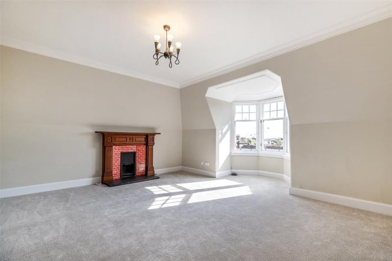 One of the four bedrooms in the property, the window looks out over Glasgow’s West End