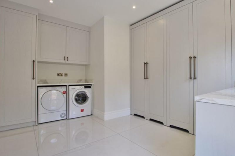 The property has a separate utility room, with plenty of storage space, a washing machine, dryer and sink.