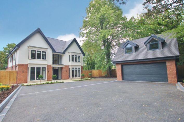 The gated property has a separate double garage.