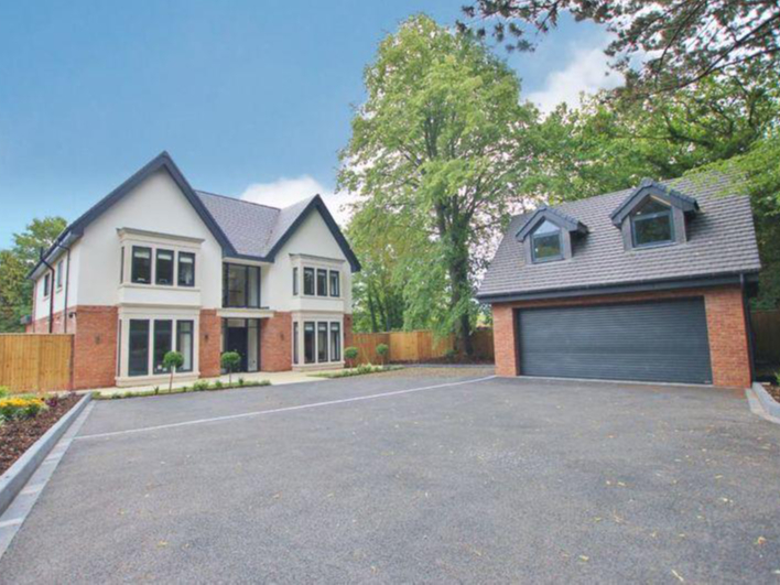 The gated property has a separate double garage.