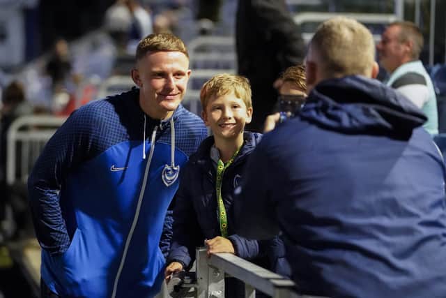 Colby Bishop with a young Pompey fan. 