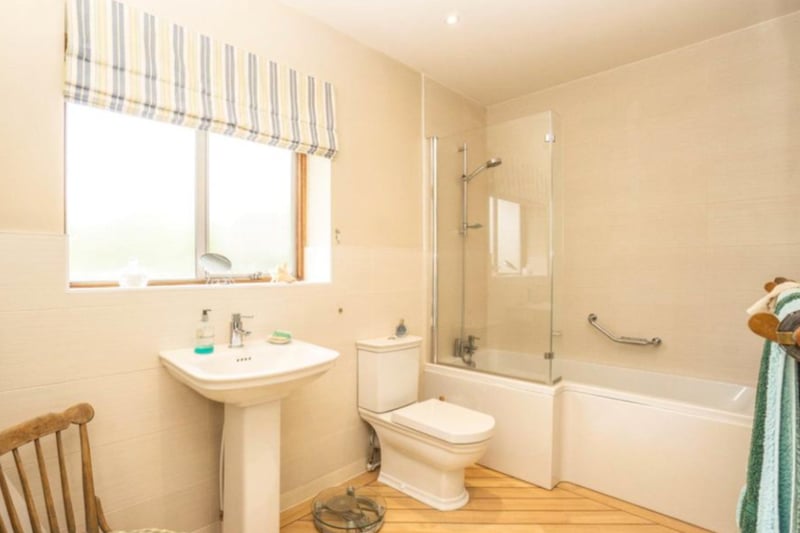 The property has a large family bathroom, with modern fixtures including a bath/shower. 
