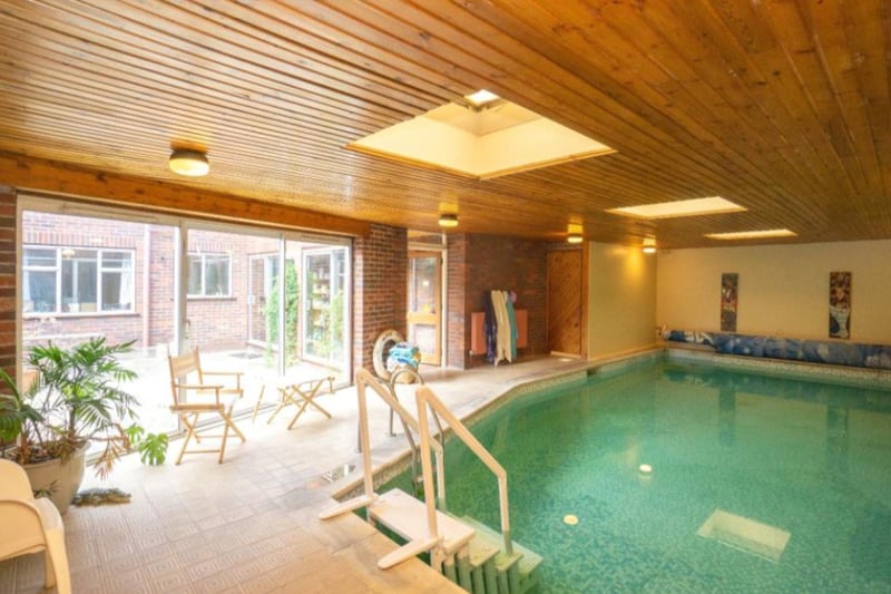 The swimming pool area feels like a spa, with a wooden ceiling and space for relaxing.