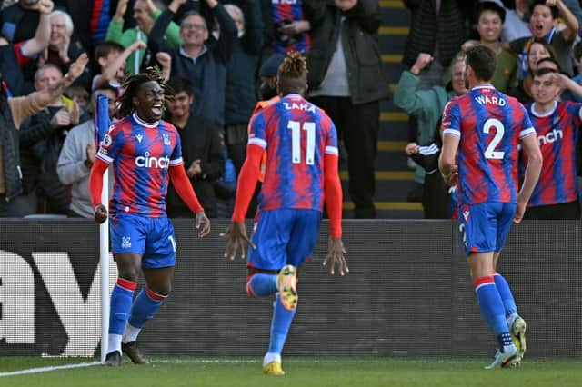 Crystal Palace's English midfielder Eberechi Eze (L) celebrates scoring the team's second goal during the English Premier League football (Photo by GLYN KIRK/AFP via Getty Images)
